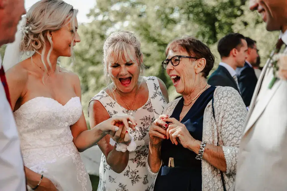 Wedding guests sharing a spontaneous moment.